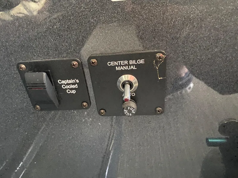 Slide: The Image of Control panel of 2018 Crest Caliber 250 SLRC with bilge switch and cooled cup holder. - 16