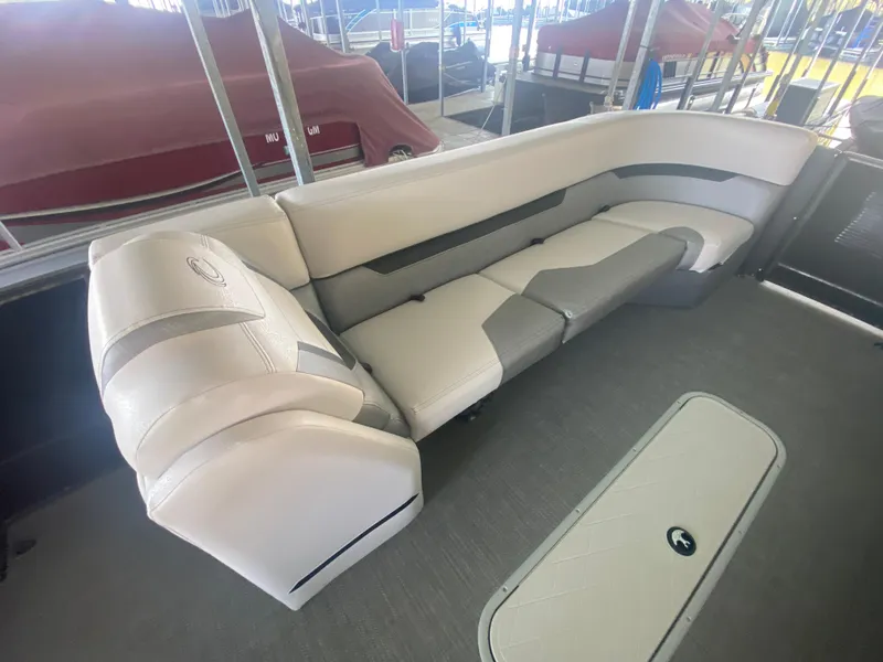 Slide: The Image of Luxurious seating on 2018 Crest Caliber 250 SLRC pontoon boat, featuring elegant upholstery. - 21