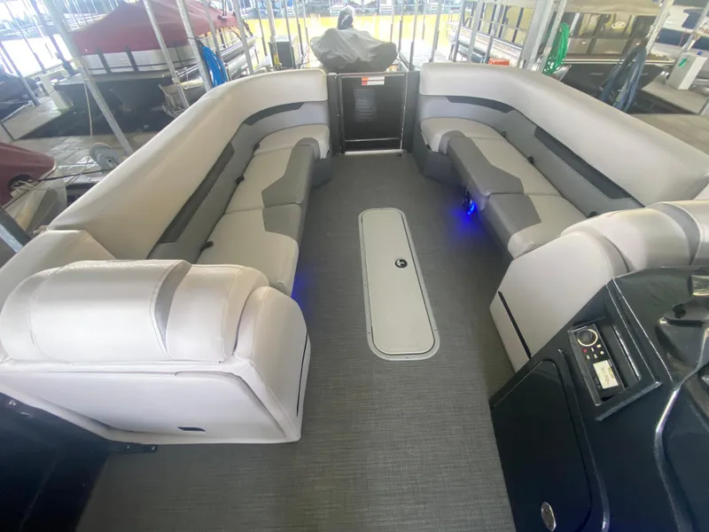 Slide: The Image of 2018 Crest Caliber 250 SLRC pontoon boat interior with spacious seating and modern design. - 24