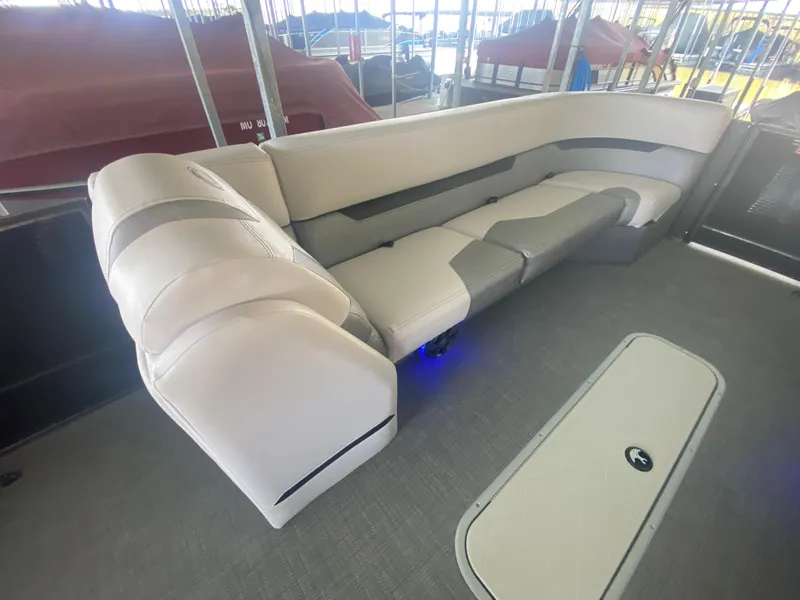 Slide: The Image of Luxurious seating on 2018 Crest Caliber 250 SLRC pontoon boat, featuring elegant upholstery. - 25
