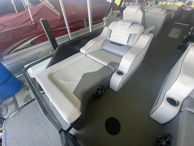 Slide: The Image of 2018 Crest Caliber 250 SLRC boat interior with luxurious seating and cup holders. - 8
