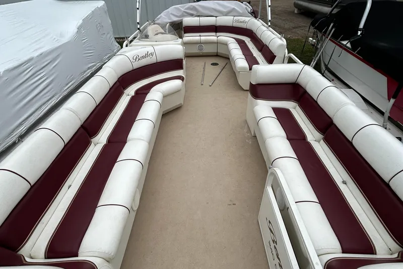 Slide: The Image of 2006 Bentley Pontoons 240 CRUISE interior with white and maroon seating. - 16