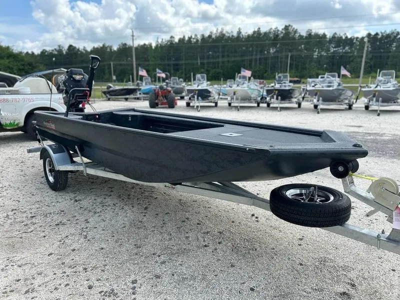 Slide: The Image of 2025 Gator Tail EXTREME MOD V 1854 boat on trailer, outdoor dealership setting. - 2