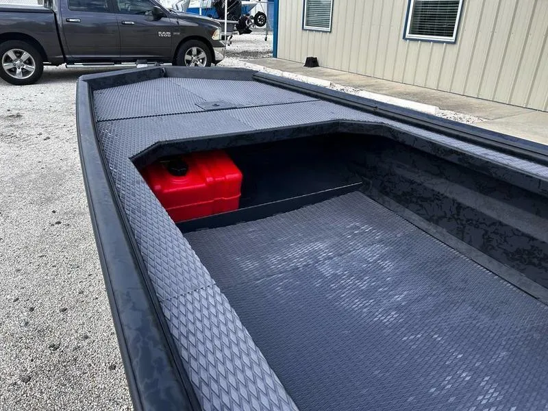 Slide: The Image of 2025 Gator Tail EXTREME MOD V 1854 boat with red fuel tank, parked outdoors. - 5