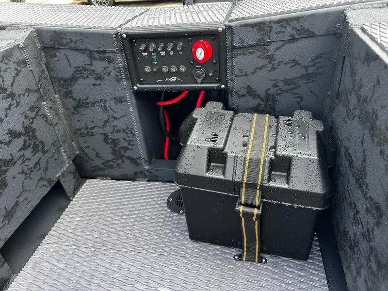 Slide: The Image of 2025 Gator Tail EXTREME MOD V 1854 boat interior with control panel and secured battery box. - 9