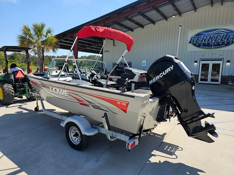 Slide: The Image of 2009 Lowe Fish & Ski FS165 boat with Mercury engine, parked outside Berkeley Outdoors. - 2