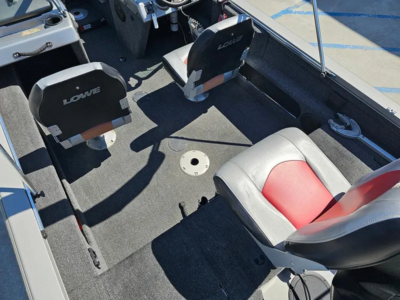 Slide: The Image of 2009 Lowe Fish & Ski FS165 boat interior with seating and steering wheel. - 9