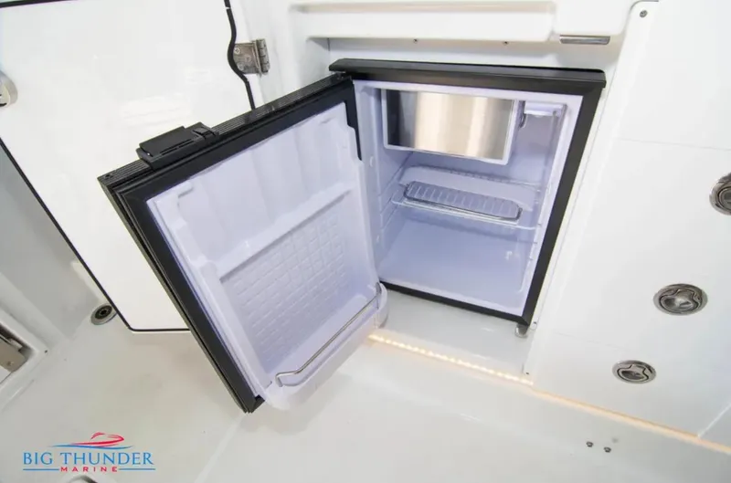 Slide: The Image of Open mini fridge on Jeanneau Leader 10.5 boat, 2020 model, by Big Thunder Marine. - 19