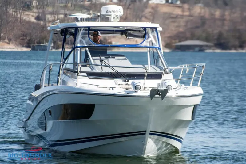 Slide: The Image of 2020 Jeanneau Leader 10.5 boat cruising on a lake with a Garmin radar. - 2