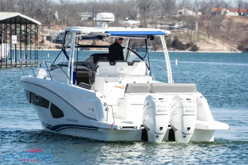 Slide: The Image of 2020 Jeanneau Leader 10.5 boat cruising on a lake with dual engines. - 6