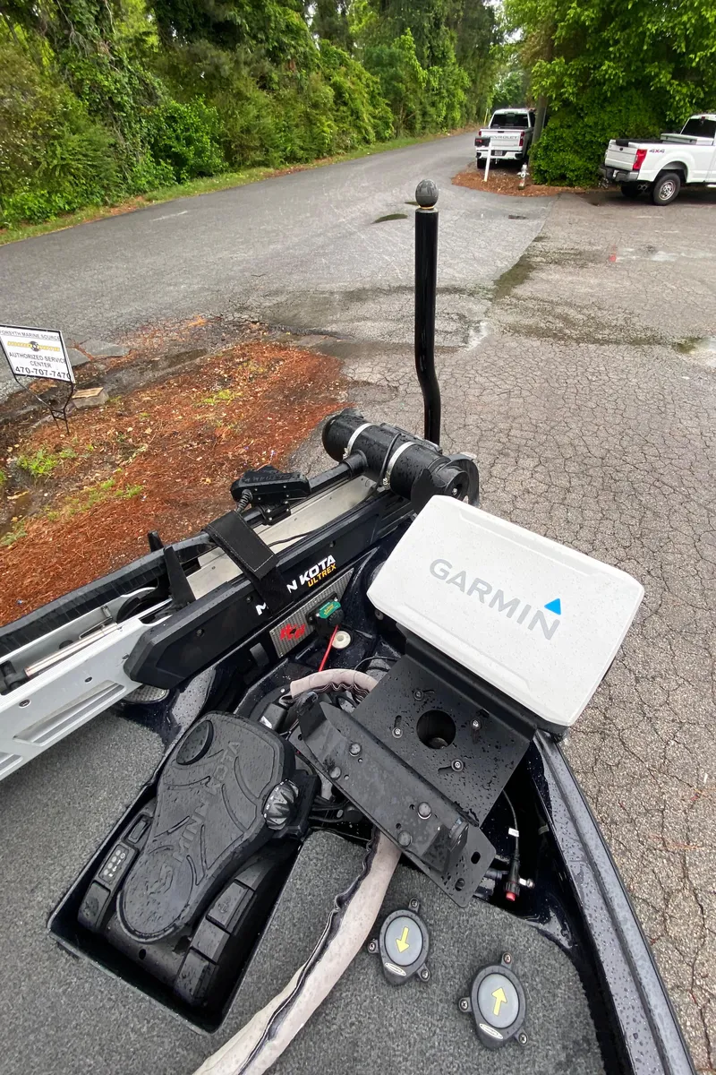 Slide: The Image of 2020 Bass Cat Eyra boat with Garmin navigation system on a paved road. - 11