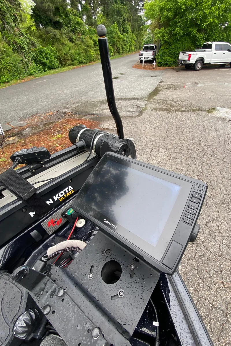 Slide: The Image of 2020 Bass Cat Eyra boat dashboard with Garmin display and Minn Kota trolling motor. - 12