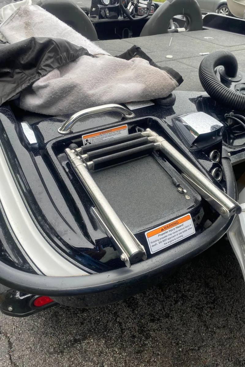 Slide: The Image of 2020 Bass Cat Eyra boat with folded ladder and equipment on deck. - 13