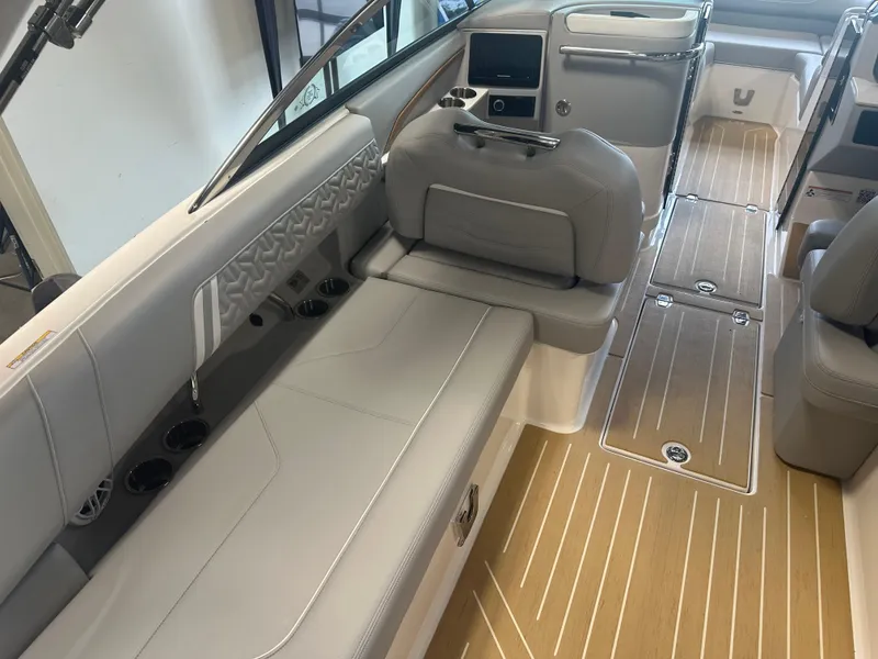 Slide: The Image of 2026 Regal LS9 boat interior with sleek seating and modern dashboard design. - 11