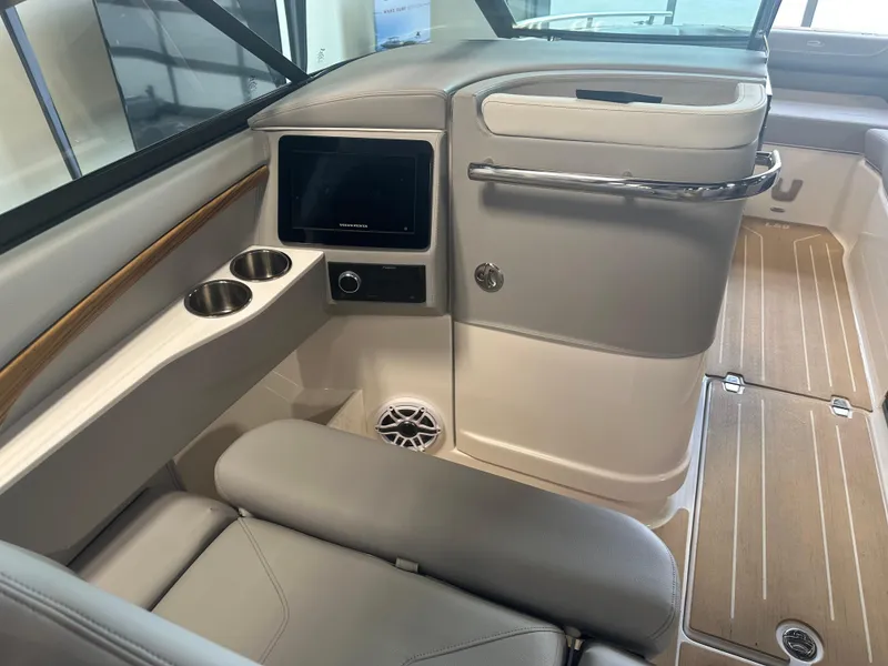Slide: The Image of Interior of 2026 Regal LS9 boat with modern seating and control panel. - 13