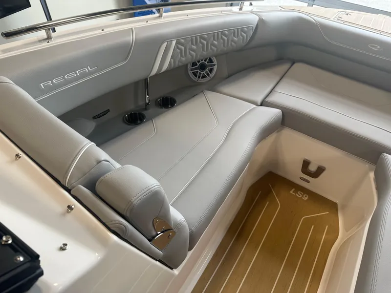 Slide: The Image of Luxurious interior of 2026 Regal LS9 boat with sleek gray seating and modern design. - 18