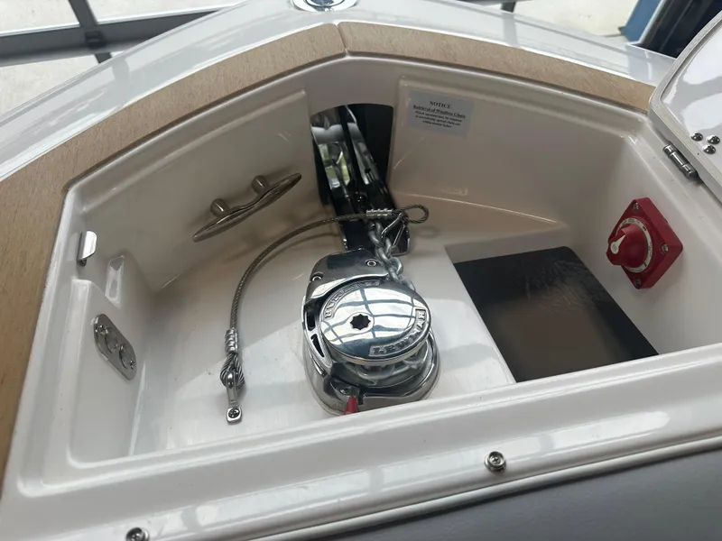 Slide: The Image of Anchor compartment of 2026 Regal LS9 boat with winch and control switch. - 20
