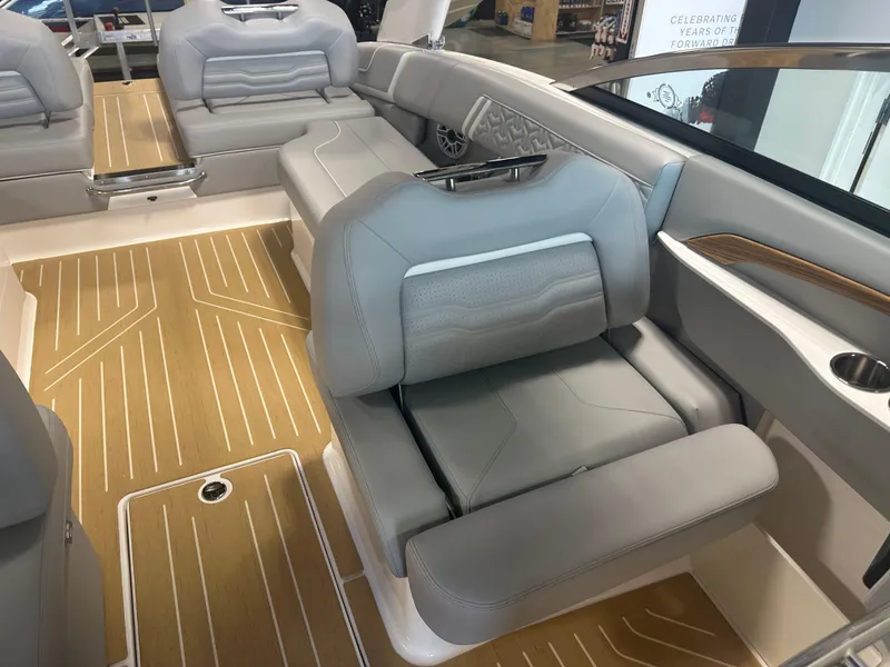 Slide: The Image of 2026 Regal LS9 boat interior with luxurious gray seating and wood-patterned flooring. - 25