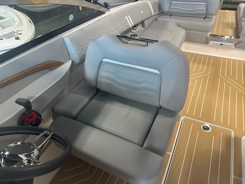 Slide: The Image of 2026 Regal LS9 boat interior with luxurious seating and modern steering wheel design. - 26