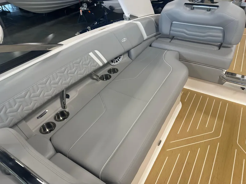 Slide: The Image of 2026 Regal LS9 boat interior with gray seating and cup holders. - 27