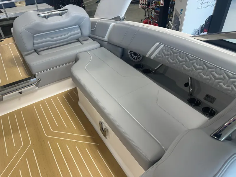Slide: The Image of 2026 Regal LS9 boat interior with luxurious gray seating and wood-patterned flooring. - 28