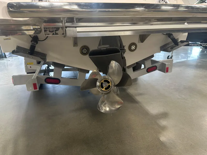 Slide: The Image of Rear view of 2026 Regal LS9 boat with propeller and trailer. - 3