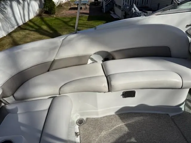 Slide: The Image of 2016 Crownline 270 SS boat interior with cushioned seating and carpeted floor. - 10