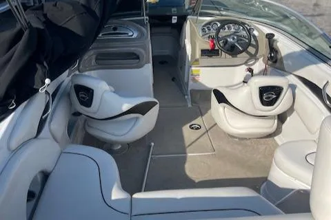 Slide: The Image of 2008 Crownline 230 LS boat interior with white seating and modern dashboard. - 12