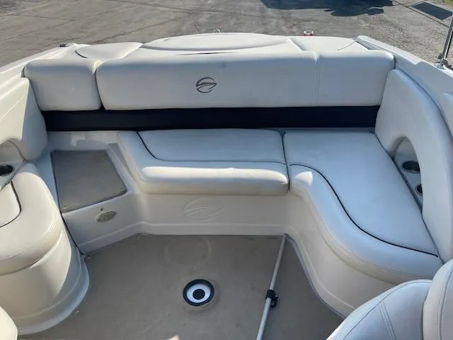 Slide: The Image of 2008 Crownline 230 LS boat interior with white cushioned seating. - 14