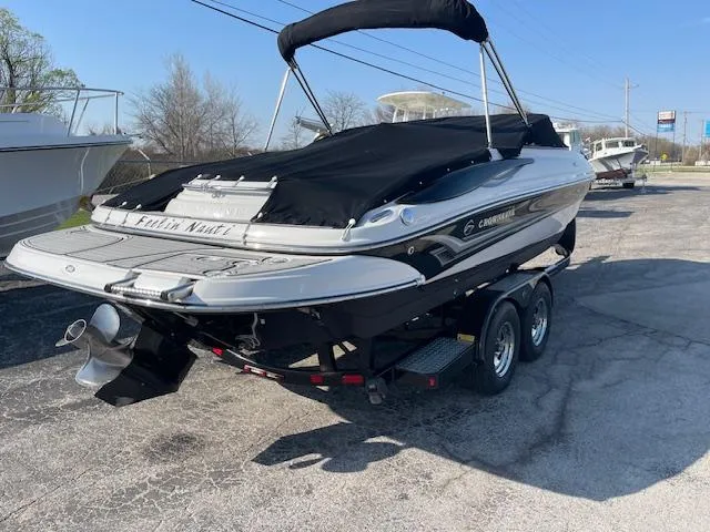 Slide: The Image of 2008 Crownline 230 LS boat on trailer, covered and parked outdoors. - 17