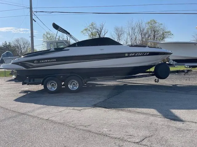 Slide: The Image of 2008 Crownline 230 LS boat on trailer in outdoor setting. - 4