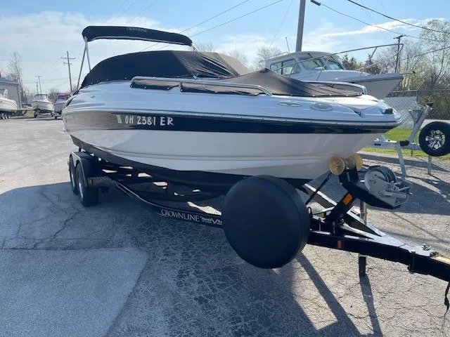 Slide: The Image of 2008 Crownline 230 LS boat on trailer, parked outdoors. - 7
