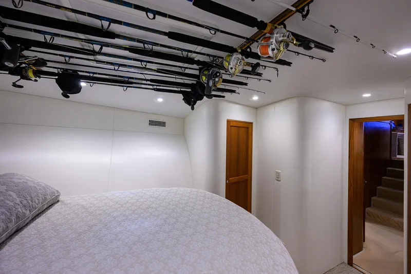 Slide: The Image of Bedroom interior of 2006 Blackwell Custom Carolina boat with fishing rods on ceiling. - 24