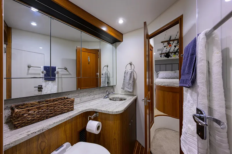 Slide: The Image of Luxurious 2006 Blackwell Custom Carolina yacht bathroom with modern amenities and elegant wood finishes. - 26