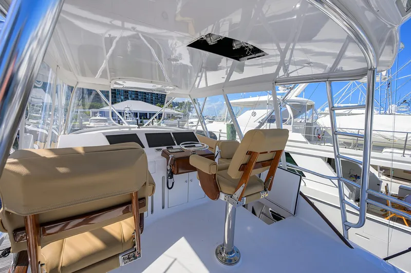 Slide: The Image of 2006 Blackwell Custom Carolina yacht helm with beige seats and modern controls. - 32