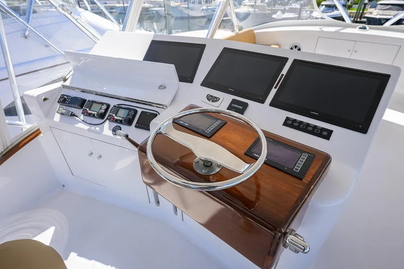 Slide: The Image of Helm of 2006 Blackwell Custom Carolina boat with modern navigation equipment and wooden steering wheel. - 35