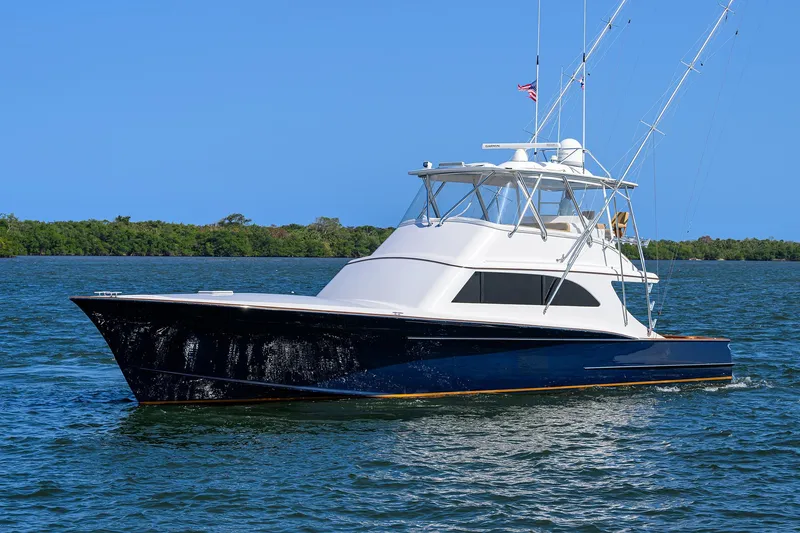 Slide: The Image of 2006 Blackwell Custom Carolina yacht on calm water under clear blue sky. - 36
