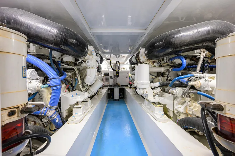 Slide: The Image of Engine room of 2006 Blackwell Custom Carolina boat, featuring complex machinery and piping. - 39