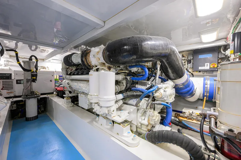 Slide: The Image of Engine room of 2006 Blackwell Custom Carolina boat, featuring advanced machinery and piping. - 40