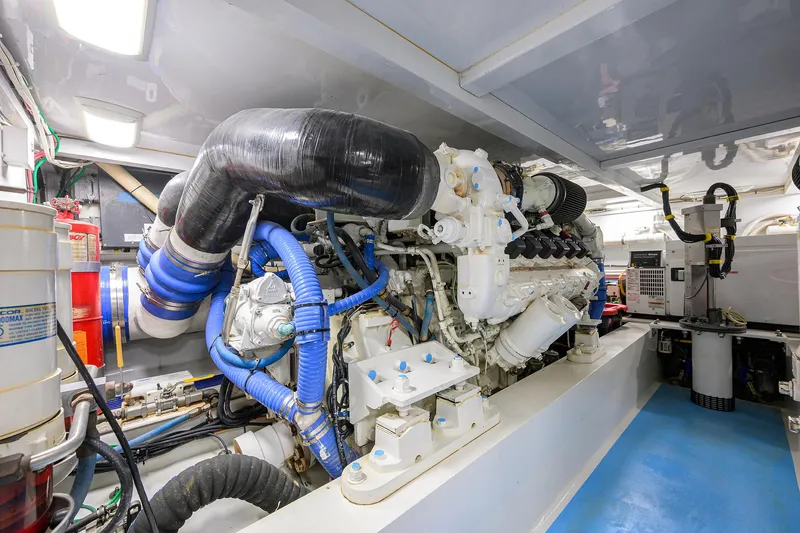 Slide: The Image of Engine room of 2006 Blackwell Custom Carolina boat, featuring complex machinery and piping. - 41
