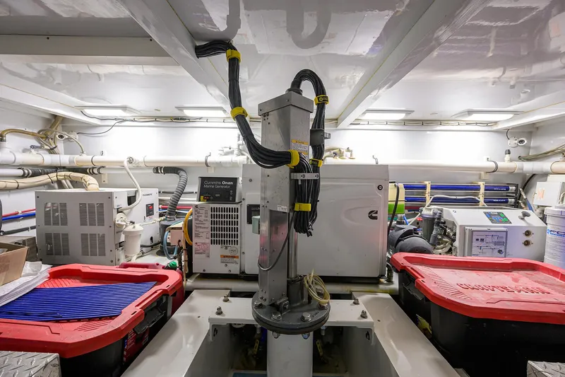 Slide: The Image of Engine room of 2006 Blackwell Custom Carolina boat with machinery and storage containers. - 42