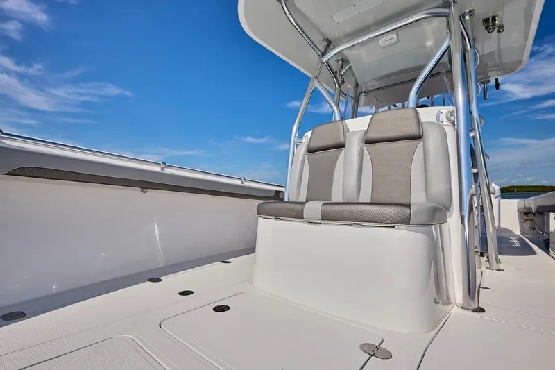 Slide: The Image of 2022 Bluewater 35 boat interior with sleek seating and modern design under clear blue sky. - 14