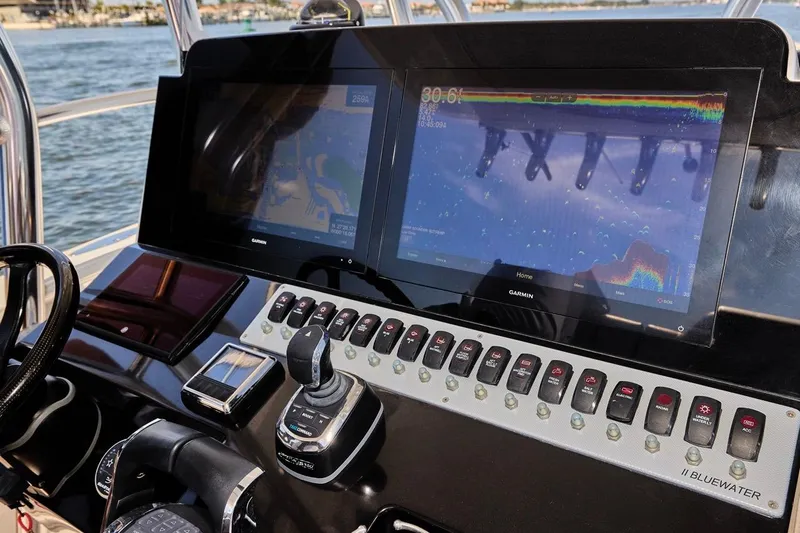 Slide: The Image of Control panel of a 2022 Bluewater 35 boat with dual Garmin displays. - 16