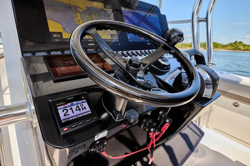Slide: The Image of Steering console of 2022 Bluewater 35 boat with advanced navigation displays. - 22