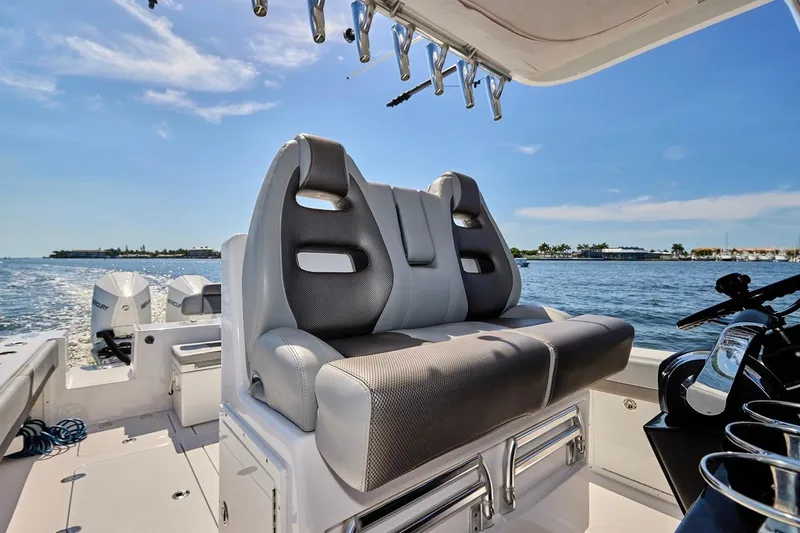Slide: The Image of Luxury seating on a 2022 Bluewater 35 boat, cruising on a sunny day. - 31