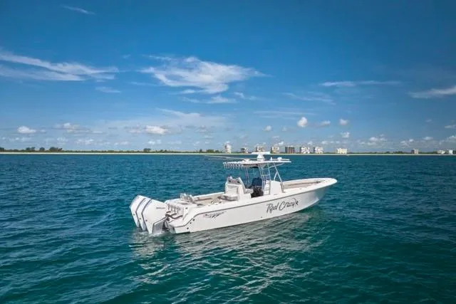 Slide: The Image of Bluewater 35 boat cruising on open sea, 2022 model, clear sky background. - 38