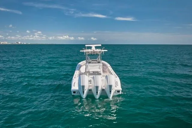 Slide: The Image of 2022 Bluewater 35 boat on open ocean under clear blue sky. - 39