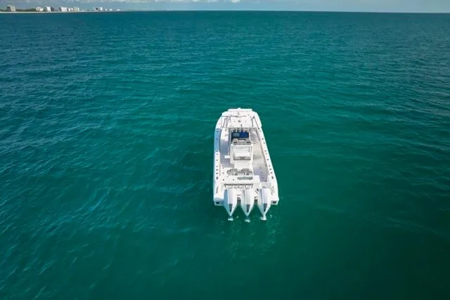 Slide: The Image of Aerial view of 2022 Bluewater 35 boat cruising on open ocean. - 40