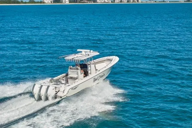 Slide: The Image of 2022 Bluewater 35 boat cruising on clear blue ocean waters. - 54