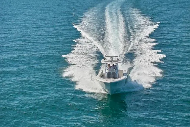 Slide: The Image of Bluewater 35 boat cruising on open sea, 2022 model, leaving a wake behind. - 61
